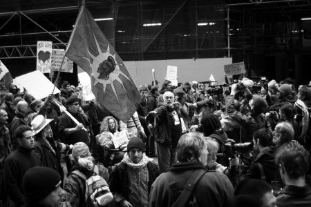 The Kanienkah Flag flies prominently at the front of the march. 