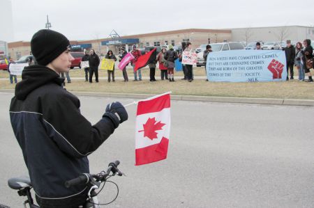 "Luke" and visiting activists take their stand