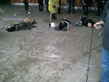 Earlier today there was a mass die-in in nathan phillips square organized by AIDS ACTION NOW against the proposed cuts to public health including HIV prevention and support (photo Minus Smile).