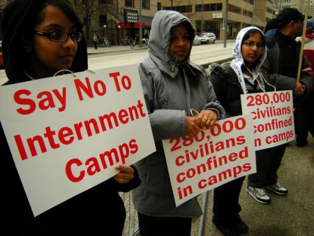 Protesters hold up signs outside the Sri Lankan consulate. Photo Credit: John Bonnar