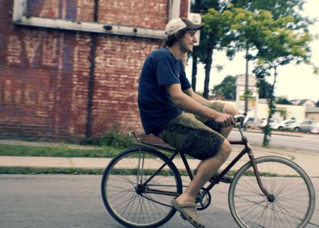 Sid, coordinator of New Hope Bike Coop, test driving a restored bike.