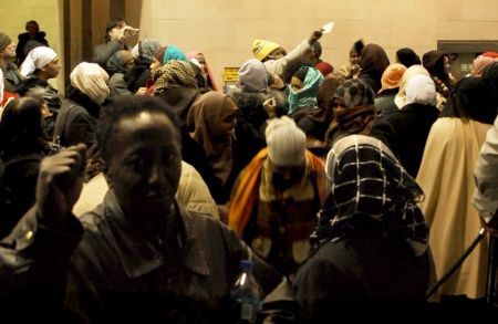 Demonstrators in Metro Hall's lobby, cut off from friends occupying the 12th floor welfare offices by electronic controls on the elevators