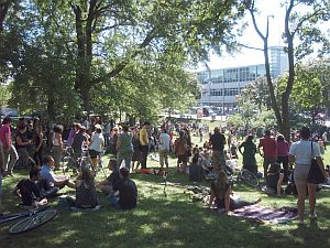 A photo of the gathering from 3:30 PM. Estimates of crowd size varies, Stop the Cuts claims 600 which is the number that signed the final declaration at the park, but many attendees casually drifted away at some point during the afternoon. The caption from this photo claims a maximum crowd of 700, this writer think this is reasonable estimate of maximum attendance but that total participation is at around 1000.  The Toronto Star claims 500. (photo from Friends of Dufferin Grove Park)