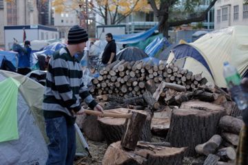 A man chops wood for the sacred fire. (photo by Kristyna Balaban: online only)