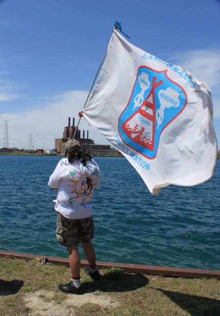 an Aamjiwnaang community member overlooks the St. Clair River