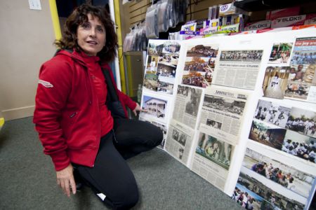 Esther Pauls, owner of Runner's Den, sharing photos and stories in Haiti