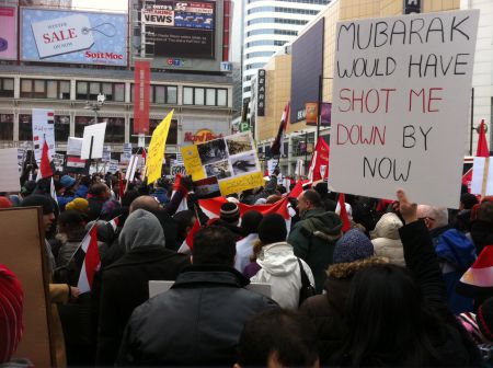 This sign compares the relative freedom to demonstrate in Canada to the severe repression in Egypt. One woman told me "I am here to express myself , secondly to support my family, my friends and my people.” (photo credit: Taylor Flook)