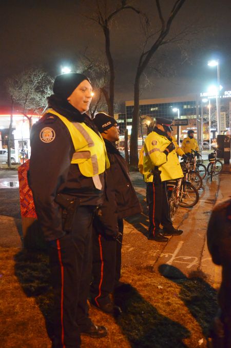 Police guarding fascists