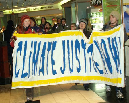 Climate activists marching through the path. Photo by David Ball