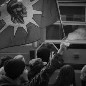 Protesters engage people in vehicles and on the sidewalks.