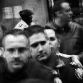 A line of Toronto police officers block the entrance to City Hall.