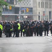 More cops 1 block east at Yonge St. and College St. (1/2 block east of Toronto police headquarters) 