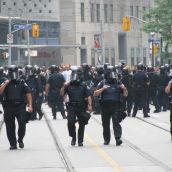 More cops 1 block east at Yonge St. and College St. (1/2 block east of Toronto police headquarters) 