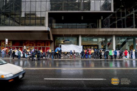 Despite the rain and cold weather, many people came out to protest Barrick Gold and support the women who went inside to testify,