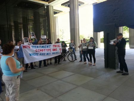 Around 20 members of the Ontario Hep C Action Coalition gather outside the Ministry of Health & Long Term Care.