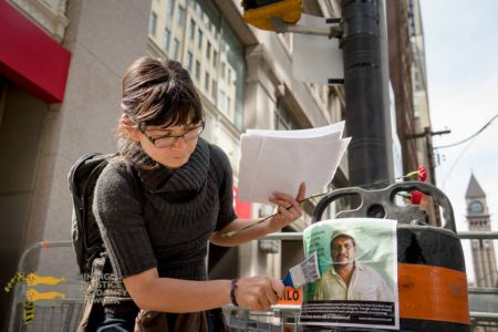 While marching, 15 different photo messages with quotes from community members impacted by Goldcorp/Tahoe's Escobal mine were pasted across the Financial District.