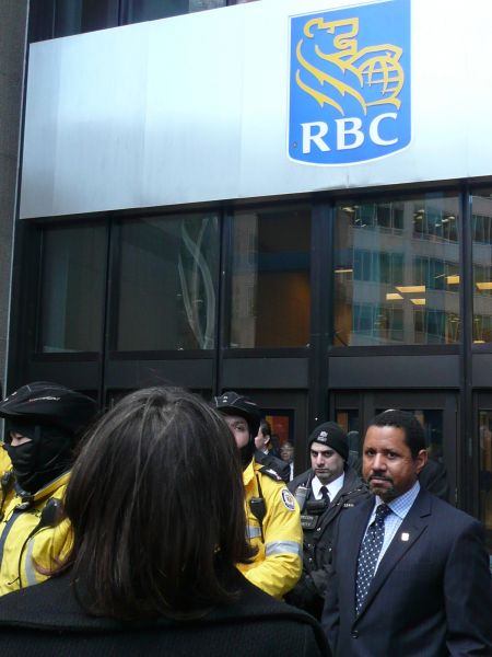 RBC representative being presented with a letter from the Unisto'ot'en people.  Photo: Hillary Lindsay