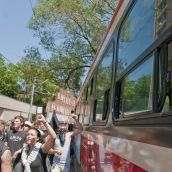 Bus rider looks on at the All Out! march - Photo: Sean Decory