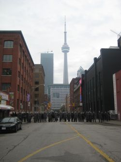 Riot cops descend on peaceful protestors. 