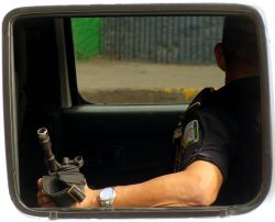 Nov. 27, 2009 - As a group of 30-40 women stand firm demanding their companeras release from police detention.  The state's coercive apparatus sends reinforcements, armed with automatic weaponry, to contain the demonstrators.