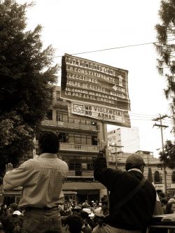 Nov. 27, 2009 - A demonstrator holds a sign that has been held at every demonstration for nearly four months.